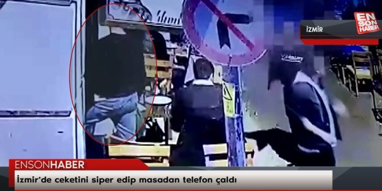 İzmir’de ceketini siper edip masadan telefon çaldı